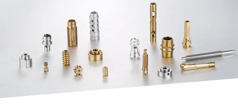 Gold- and silver-coloured CNC turned parts