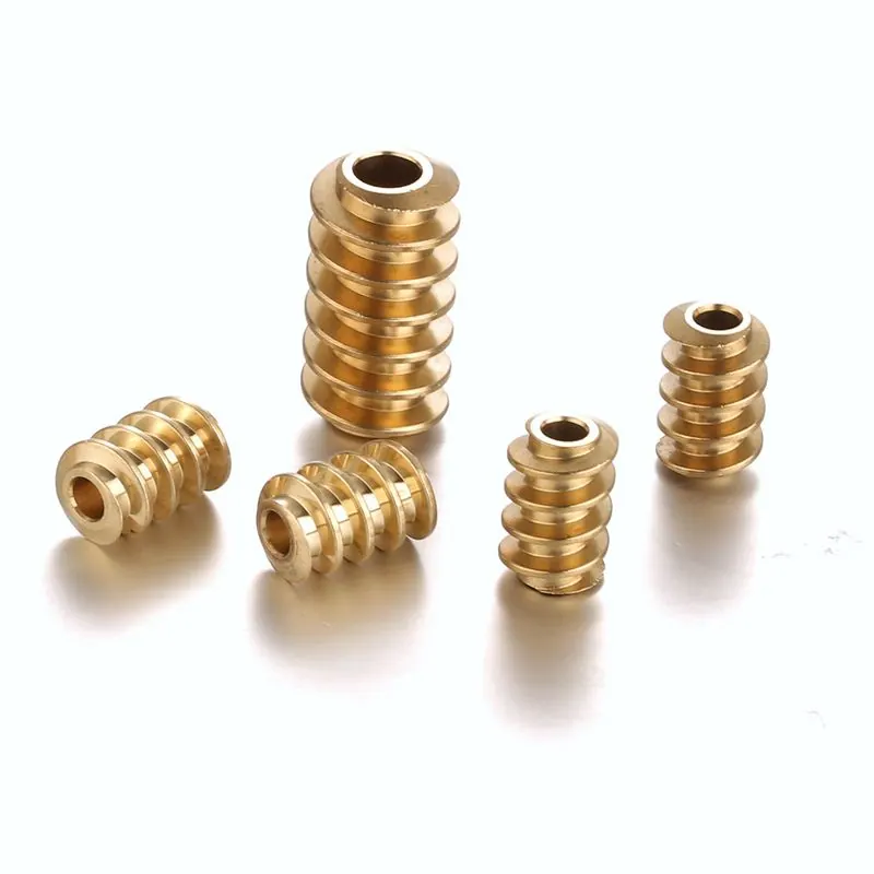 Gold- and silver-coloured CNC turned parts