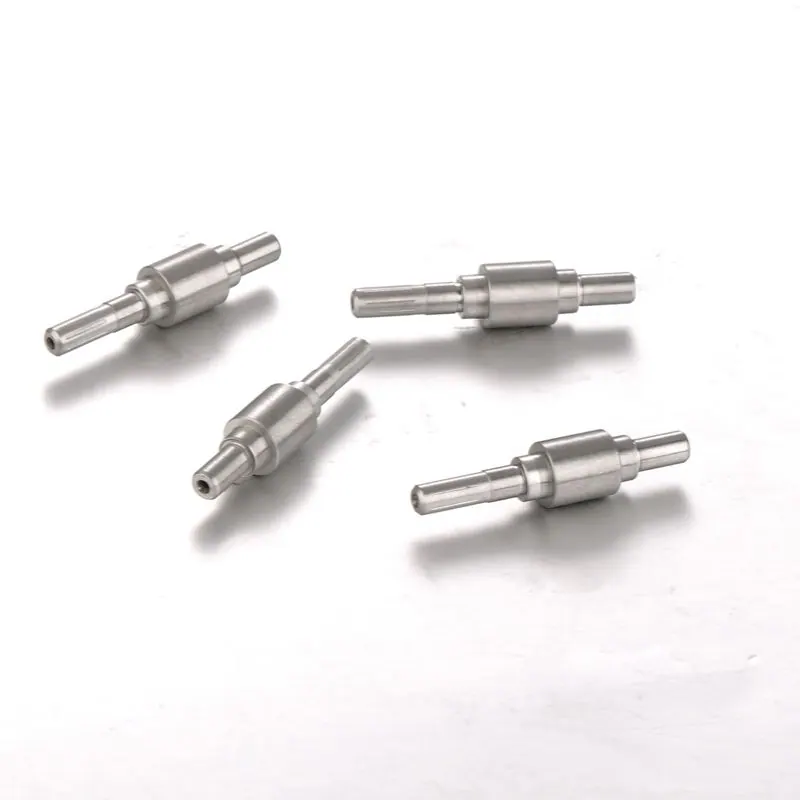 Stepped shafts with collars arranged on a light background