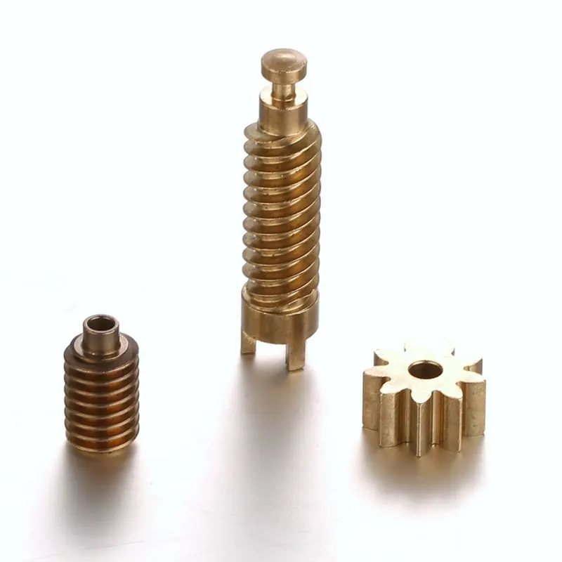 Gold-coloured worm, threaded part and gear